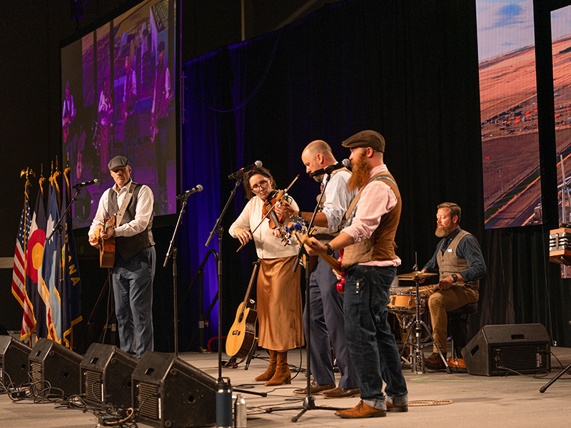 Asher performing on the main stage during the 2025 Basin Electric Annual Meeting banquet.