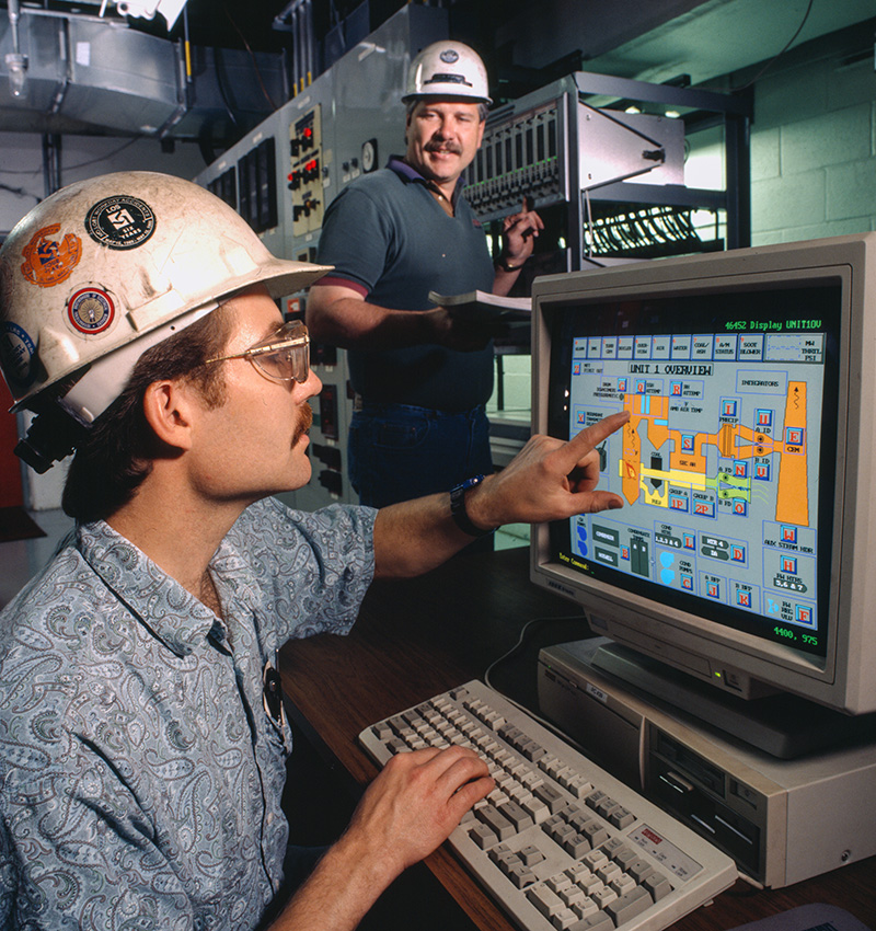 Basin Electric employees Joe Fiedler and Tim Forsch doing Y2K preparations at Leland Olds Station in 1998.