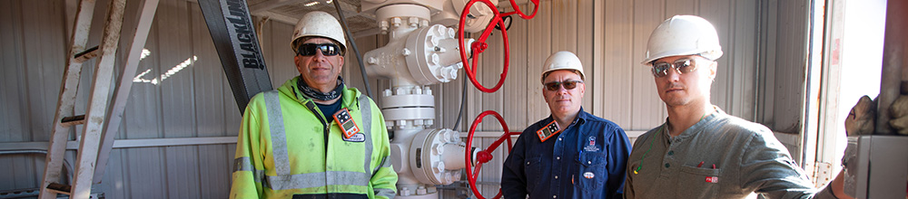 Employees in front of CO2 injection head