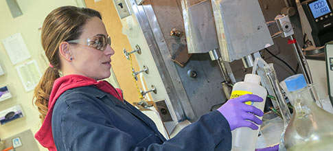 woman in chem lab